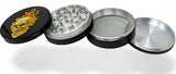 Open 4-piece herb grinder with skull flame design, showing grinding teeth, mesh screen, and storage compartment.