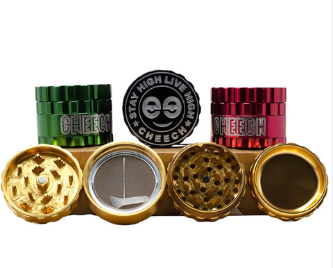Set of 62mm Cheech embossed logo grinders in green, red, and gold, with multiple compartments for grinding and collecting, featuring the "Stay High, Live High" slogan.