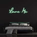 LED Neon Sign – 'Love Me' wall decor for bedrooms or events, perfect for creating a romantic and inviting ambiance.