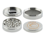 Green Monkey 75mm Capuchin Grinder – Classic 4-piece design with mesh screen and scraper for efficient herb grinding and storage.