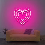 Heart LED neon sign in soft pink, creating a cozy and inviting atmosphere for your home or special occasions.