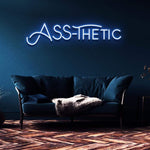 ASS-THETIC Neon Sign – LED wall decor for home or studio, adding a fun and cheeky touch with vibrant colors and easy installation.