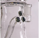 Close-up of Bear Quartz x Kenta Kito glass rig showcasing green accent marbles and precision craftsmanship