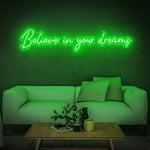 Believe in Your Dreams LED neon sign in green, adding vibrancy to a stylish room decor.