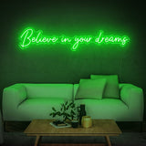Believe in Your Dreams LED neon sign in green, adding vibrancy to a stylish room decor.