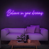 Believe in Your Dreams LED neon sign in purple, enhancing a cozy living room ambiance