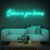 Believe in Your Dreams LED neon sign in teal, creating a relaxing vibe in a contemporary living space