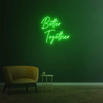 Better Together green LED neon sign displayed on a greenery background, perfect for wedding or event decor