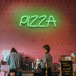Bright and fun Pizza LED Neon Sign, shaped like a pizza slice, perfect wall decor for pizzerias, restaurants, or pizza lovers at home.