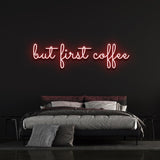 Red "But First Coffee" LED neon sign featured in a trendy bedroom with a black background, perfect for coffee-inspired wall decor.