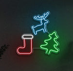LED neon sign displaying Christmas icons: a glowing blue reindeer, green tree, and red stocking, perfect for holiday decorations and festive lighting.