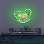 Dead Bear LED Neon Sign in green color mounted on a wall, perfect for modern room decor or gaming setups. Adds a trendy and vibrant touch to your space.