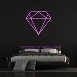 purple diamond-shaped LED neon sign on black wall in modern bedroom with bed and pillows.
