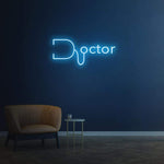Blue doctor LED neon sign on wall with modern decor in dark room, medical and healthcare neon light design.