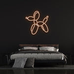 Dog balloon LED neon sign in warm orange light, modern wall art for bedrooms. Unique decorative piece inspired by Jeff Koons, ideal for home interiors.