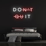 Don't Quit red and white LED neon sign as bedroom wall decor for inspirational and motivational ambiance.