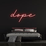Dope LED neon sign in vibrant red color, creating a bold aesthetic in a minimalist black-walled bedroom.