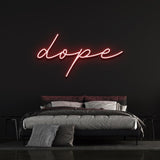 Dope LED neon sign in vibrant red color, creating a bold aesthetic in a minimalist black-walled bedroom.