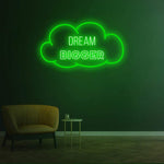 Dream Bigger green neon sign in a cloud shape, perfect for modern wall decor and inspirational lighting ideas