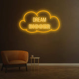Dream Bigger yellow neon sign in a cloud shape, ideal for creating warm and motivational spaces