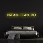 Yellow "Dream, Plan, Do" LED neon sign for bright bedroom lighting ideas.