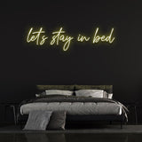 Sustainable 'Let's Stay in Bed' LED neon sign for long-lasting brightness and bedroom decor."
