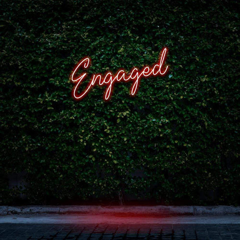Engaged red neon sign, perfect for romantic decor and wall art for special moments.
