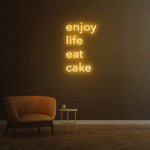 Enjoy Life Eat Cake yellow neon LED sign for vibrant interior decoration, suitable for kitchens and bakeries.