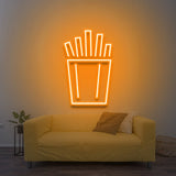 "Vibrant French fries LED neon sign radiating orange light, a bold decor element for restaurants or game rooms.