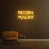  Vibrant Orange "Frozen Yogurt" LED neon sign illuminating cafe wall.