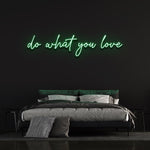 Green 'Do What You Love' neon sign in bedroom decor, motivational wall art