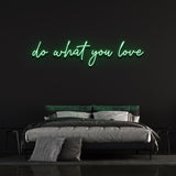 Green 'Do What You Love' neon sign in bedroom decor, motivational wall art