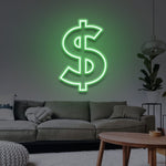 Green dollar LED neon sign illuminating a modern living room with a stylish gray sofa and cozy decor.