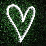 Heart neon sign in classic white, a romantic and playful illuminated wall decor for home or office, perfect for trendy and stylish rooms.