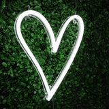 Heart neon sign in classic white, a romantic and playful illuminated wall decor for home or office, perfect for trendy and stylish rooms.