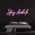 viting "Stay Awhile" LED Neon Light perfect for modern home or office decor, providing a warm and peaceful atmosphere.
