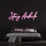 viting "Stay Awhile" LED Neon Light perfect for modern home or office decor, providing a warm and peaceful atmosphere.