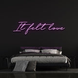 It Felt Love Neon Sign in vibrant purple, LED wall decor for romantic home and event settings, long-lasting and easy to install.