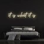 It Is What It Is LED Neon Sign in crisp white, versatile decor for homes and offices, adding a touch of modern elegance to any room.