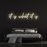 It Is What It Is LED Neon Sign in crisp white, versatile decor for homes and offices, adding a touch of modern elegance to any room.