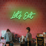 Add personality with the 'Let's Eat' LED neon sign – Ideal for dining rooms, kitchens, and restaurants.