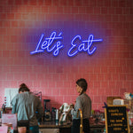 'Let's Eat' LED neon sign – Vibrant and eye-catching decoration for restaurants, cafes, and dining spaces.