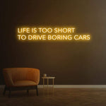 Exciting 'Life Is Too Short To Drive Boring Cars' LED neon sign, perfect for upgrading garage and car decor.