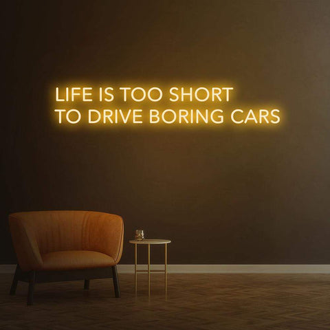 Exciting 'Life Is Too Short To Drive Boring Cars' LED neon sign, perfect for upgrading garage and car decor.