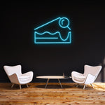 Light blue Cheesecake LED neon sign, designed for chic wall decor and hospitality spaces.