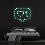 Bold 'Like' neon light with colorful glow, adds modern style to any room or office decor.