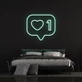 Bold 'Like' neon light with colorful glow, adds modern style to any room or office decor.