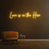 Love Is in the Hair Neon Light – Playful and modern LED wall décor for hair salons, adding charm and style.