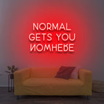 Vibrant red 'Normal Gets You Nowhere' LED neon sign, a powerful statement piece for any room, encouraging ambition and a unique, goal-oriented mindset.