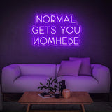 Elegant purple 'Normal Gets You Nowhere' LED neon sign, ideal for adding a modern and motivational touch to your office, gym, or home.
